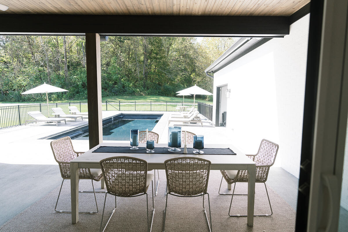 outdoor dining area by pool
